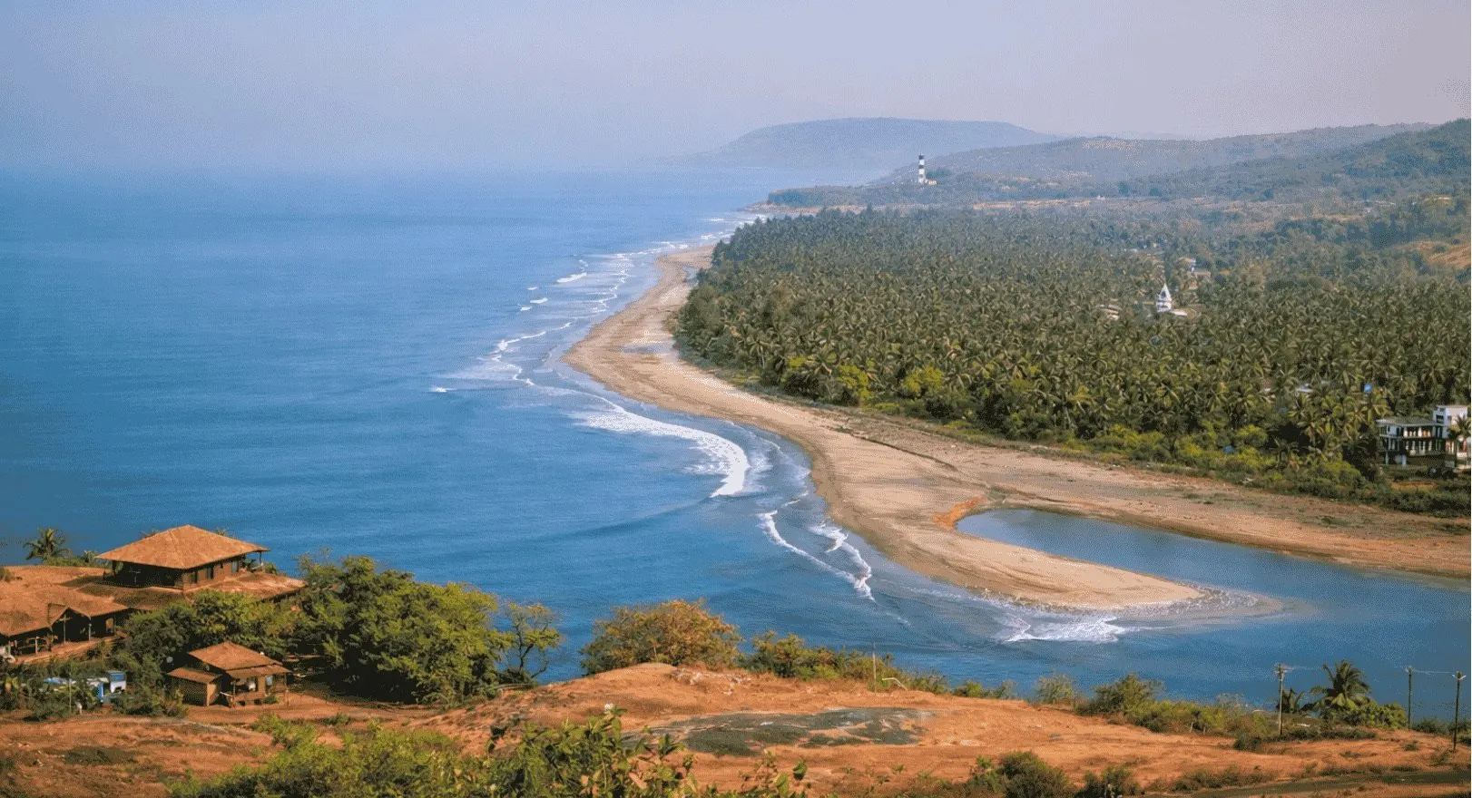 Aerial view of Anjarle beach, coconut groves and the Jog river estuary in Dapoli