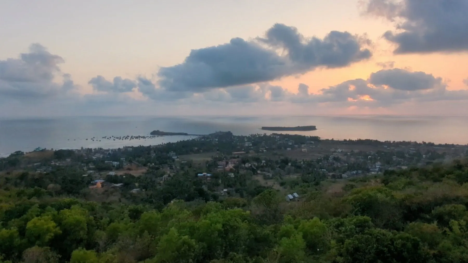 View over the green Dapoli coastline towards the Arabian Sea at sunset